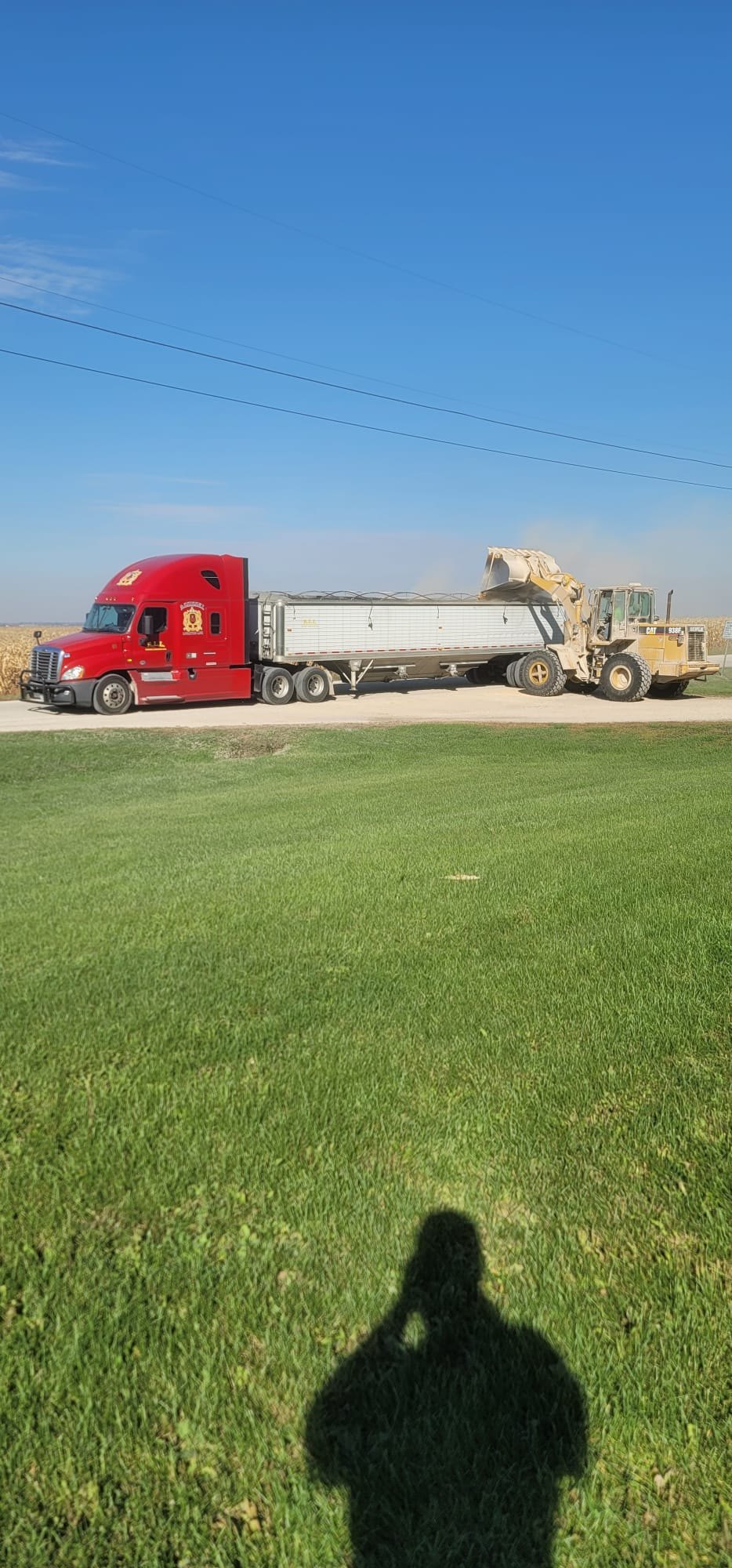 Assissel grain hauling truck working in a farm field