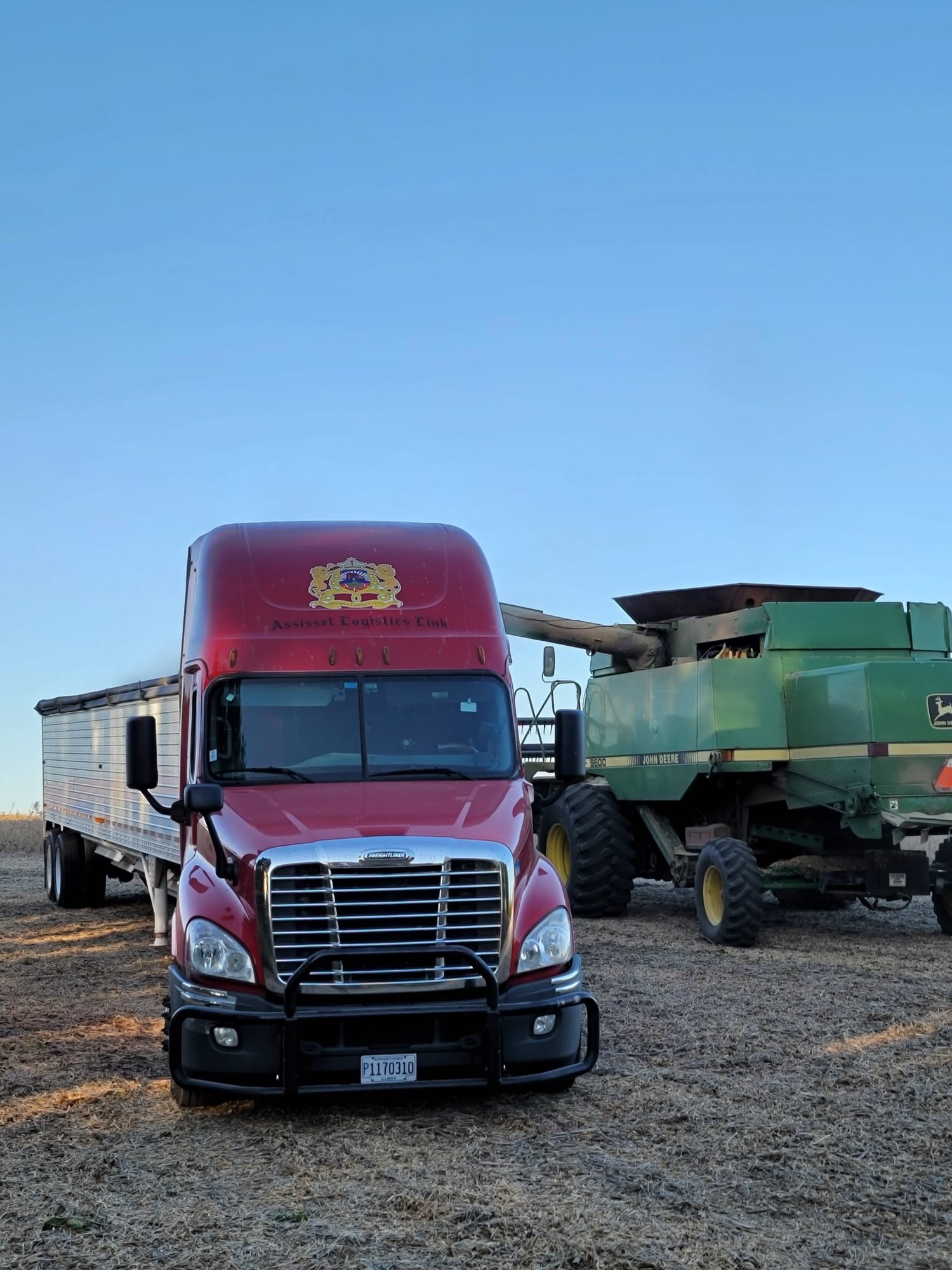 Truck beside agricultural machinery