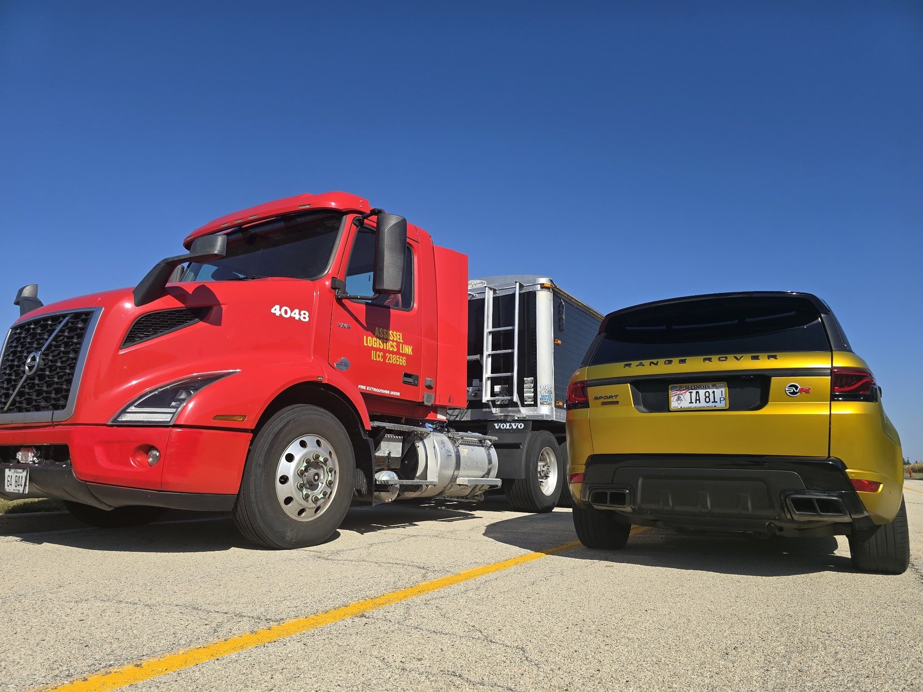 Red Assissel truck and grain trailer